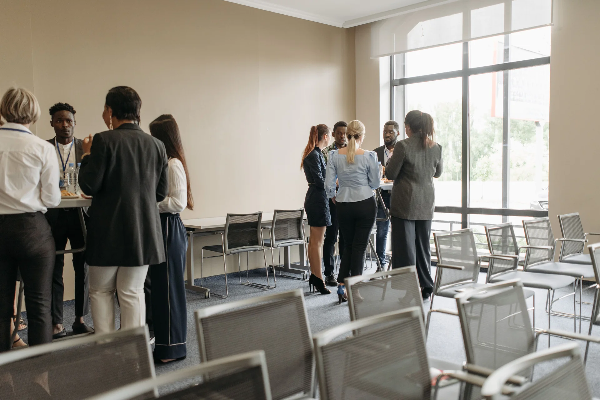 Professionals networking and talking at a business conference
