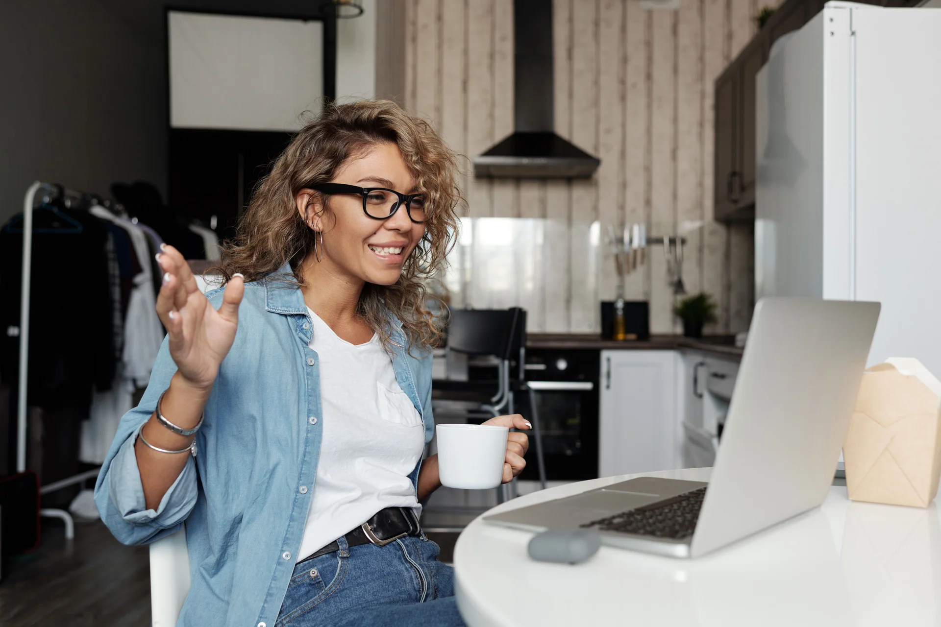 Smiling woman talking on a video call from home
